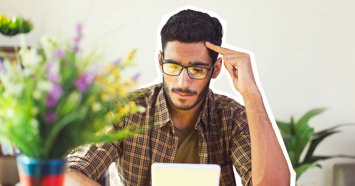 man looking at tablet worriedly og